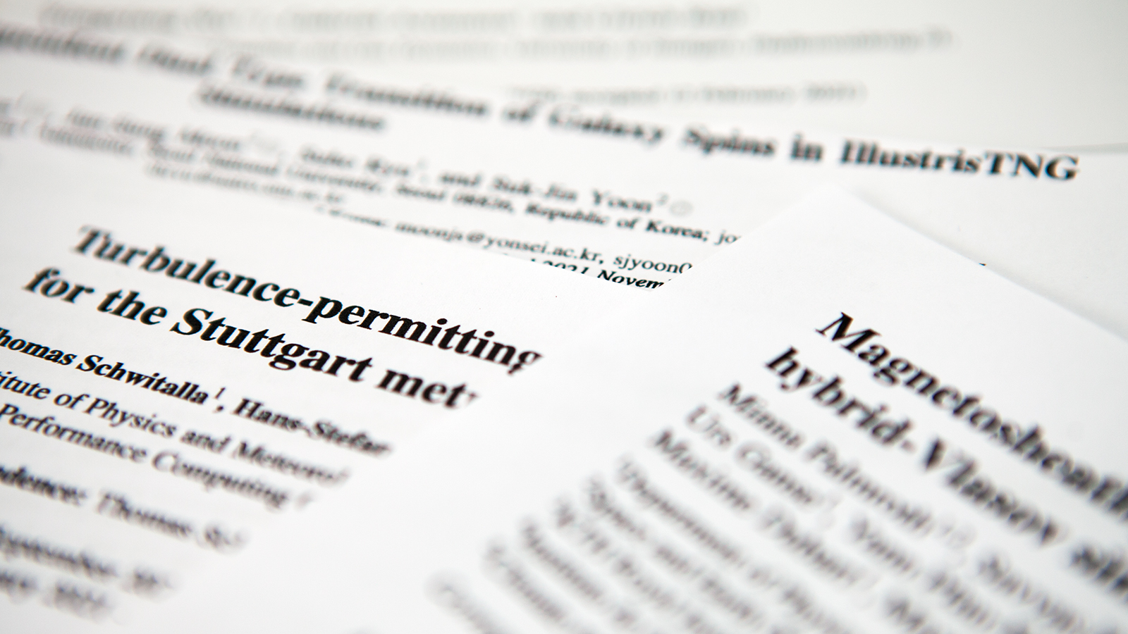 Photo of user research publication papers.